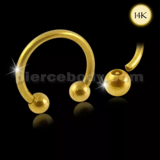 gold circular barbell