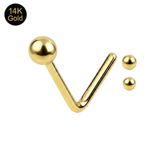 Macro view of a 14K solid yellow gold ball nose stud highlighting the artisan-buffed mirror finish.