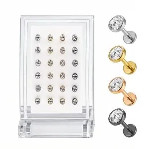 Professional wholesale display of a 24-piece G23 titanium oval CZ labret kit arranged in assorted silver, gold, rose gold, and black finishes.
