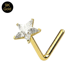 Close-up macro view of the star-cut stone and claw setting on a 9k gold radiant star nose stud.
