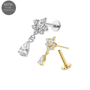 ASTM F-136 implant grade titanium threadless labret studs featuring a clear marquise and round CZ flower cluster top with a dangling teardrop pear stone in polished titanium and gold PVD styles.