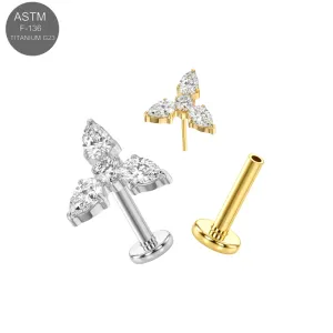 ASTM F-136 implant grade titanium threadless flat back labret jewelry featuring a cluster top with three prong-set clear marquise CZ crystals spreading out from a central round stone base, in plain titanium and Gold PVD variants.