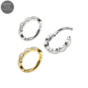 G23 titanium marquise-cut CZ eternity hinged clicker rings in plain titanium and gold PVD with open hinge mechanism.