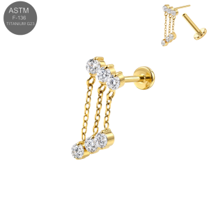 Anodized yellow gold PVD vacuum treated implant grade titanium threadless labret earring displaying clear white cubic zirconia gemstone crowns fixed with three flowing draped accent chains.